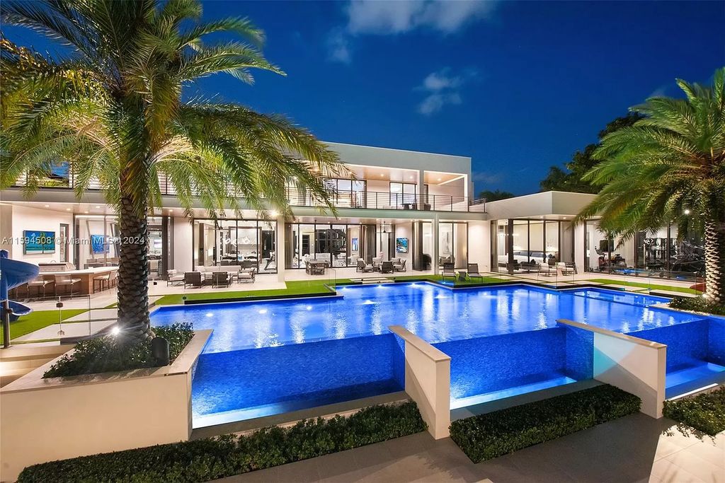 Welcome to 298 W Key Palm Rd, a spectacular newly built waterfront estate by SRD Building Corp. Located in Boca Raton's prestigious Royal Palm Yacht & Country Club, this luxurious home offers over 11,471 square feet of living space on a 26,728 square feet lot.