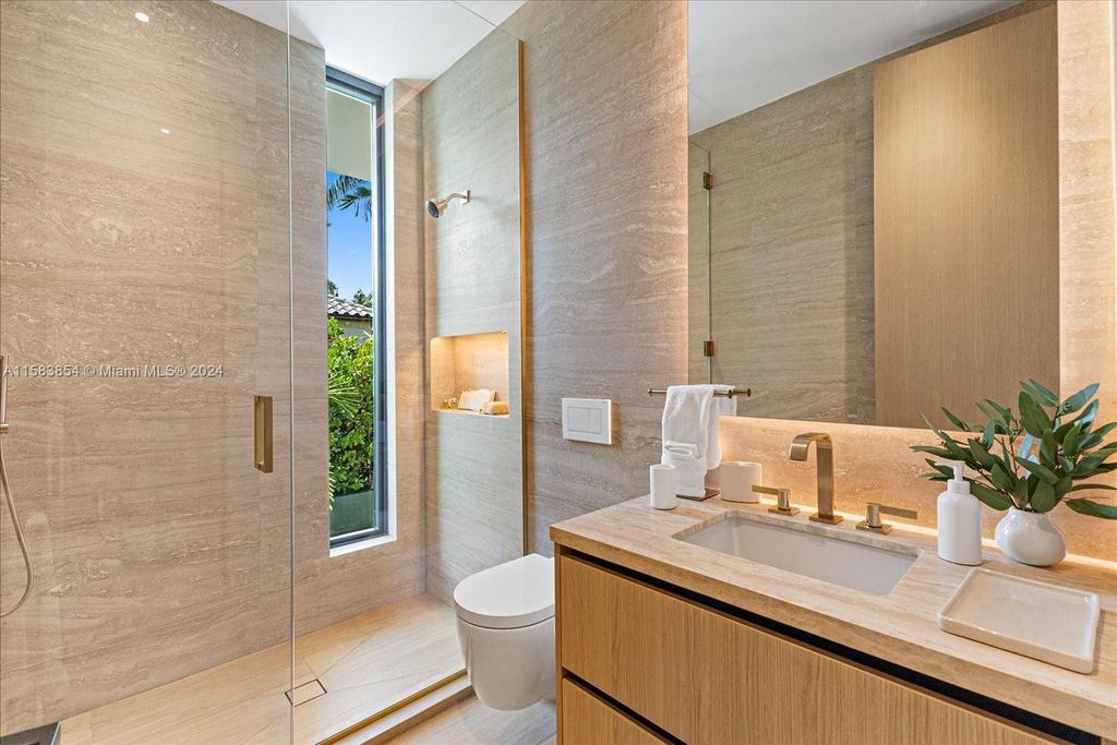 Nestled within Sunset Islands III, this luxurious Miami Beach property at 1510 W 23rd St offers the epitome of waterfront living.
