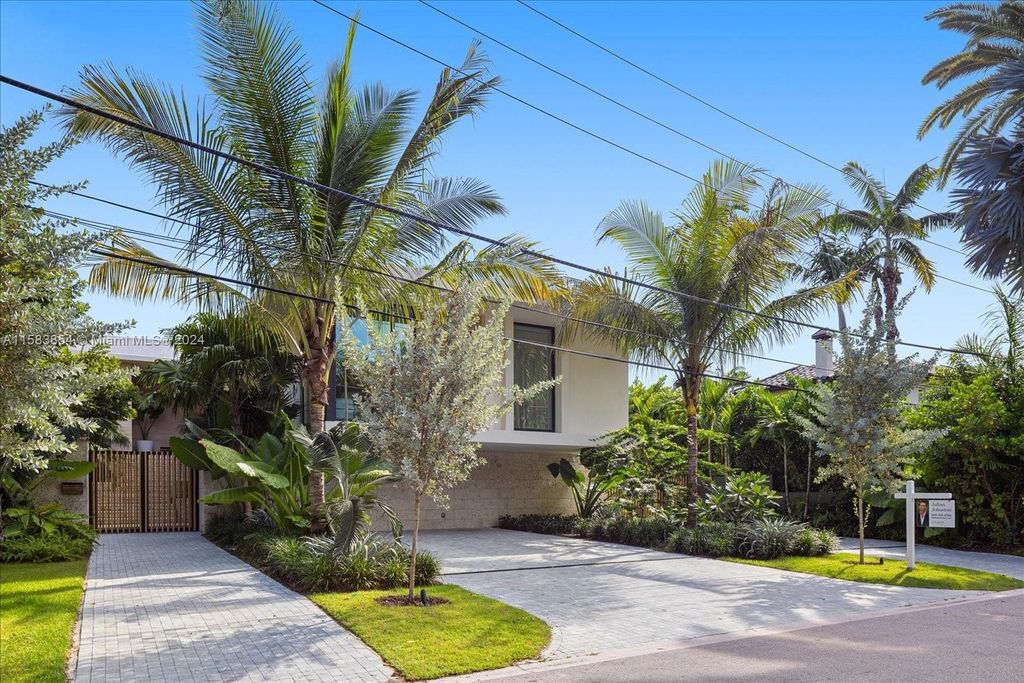 Nestled within Sunset Islands III, this luxurious Miami Beach property at 1510 W 23rd St offers the epitome of waterfront living.