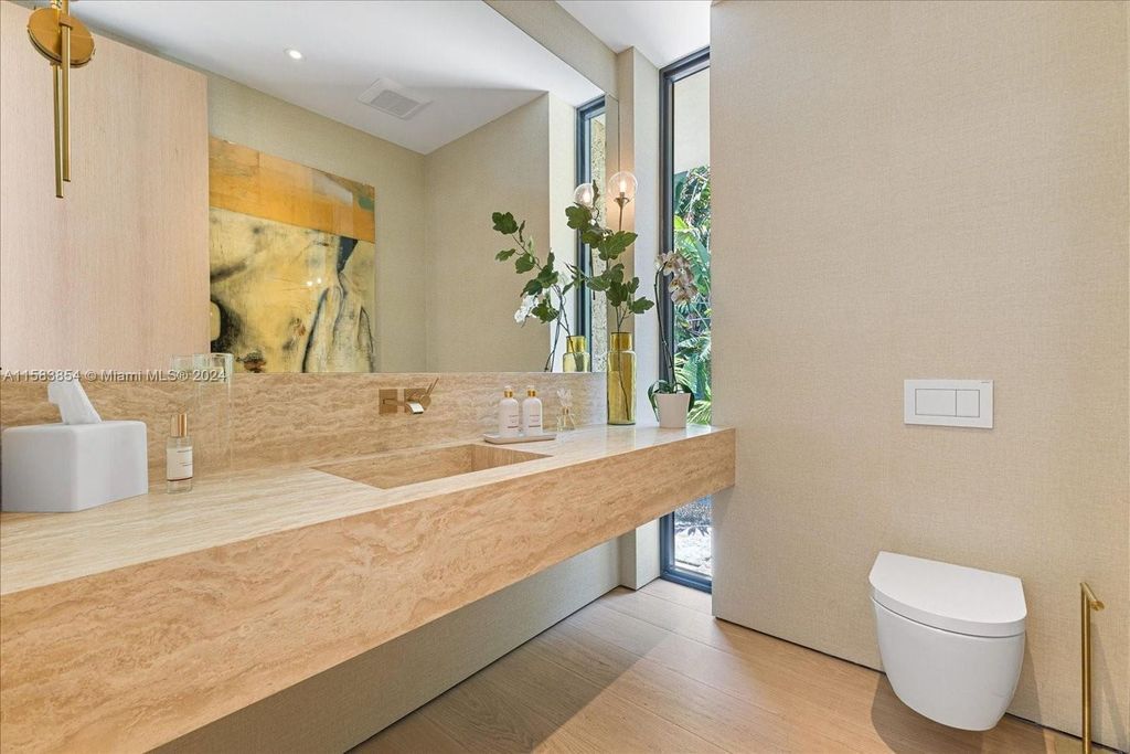 Nestled within Sunset Islands III, this luxurious Miami Beach property at 1510 W 23rd St offers the epitome of waterfront living.