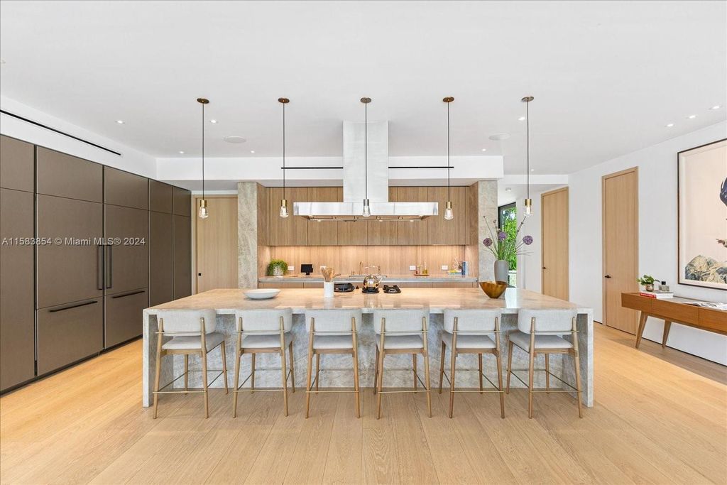 Nestled within Sunset Islands III, this luxurious Miami Beach property at 1510 W 23rd St offers the epitome of waterfront living.