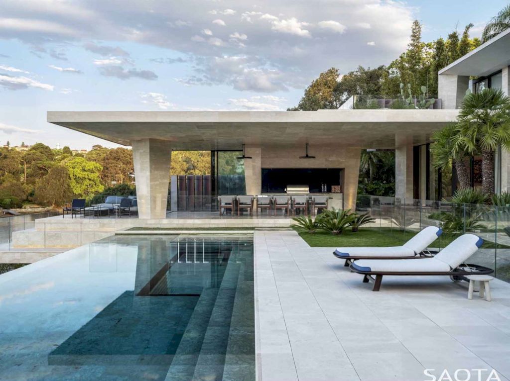 Water's Edge with Stone Covers Exterior & Interior by SAOTA