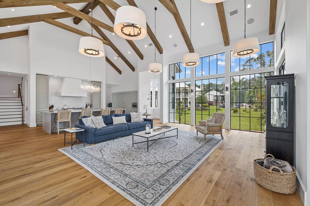 Nestled on a double homesite with 150'+ of Choctawhatchee Bay frontage in the prestigious gated enclave of Churchill Oaks, 51 Junop Court is a stunning legacy residence designed by Matt Savois and built by Grand Bay Construction.