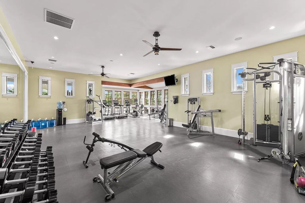 Nestled on a double homesite with 150'+ of Choctawhatchee Bay frontage in the prestigious gated enclave of Churchill Oaks, 51 Junop Court is a stunning legacy residence designed by Matt Savois and built by Grand Bay Construction.