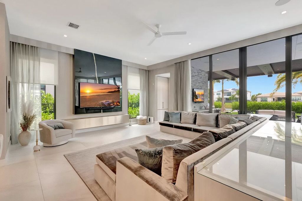 Welcome to this lavish modern luxury estate in the prestigious Boca Bridges. This distinguished "Dali" contemporary masterpiece, one of only seven, spans 8,000 square feet on a large waterfront lot.