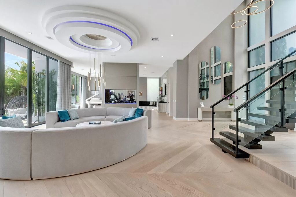 Welcome to this lavish modern luxury estate in the prestigious Boca Bridges. This distinguished "Dali" contemporary masterpiece, one of only seven, spans 8,000 square feet on a large waterfront lot.