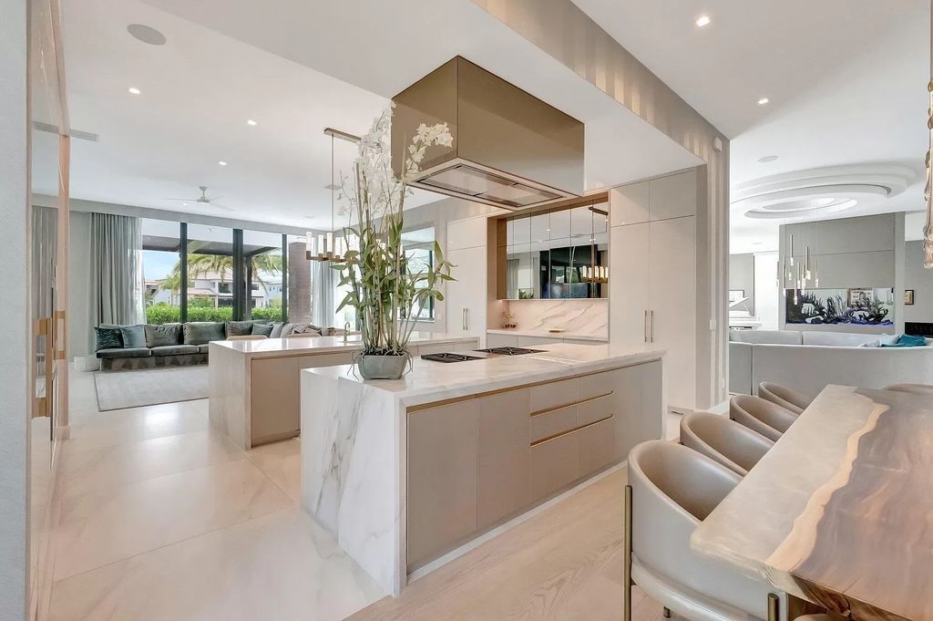 Welcome to this lavish modern luxury estate in the prestigious Boca Bridges. This distinguished "Dali" contemporary masterpiece, one of only seven, spans 8,000 square feet on a large waterfront lot.