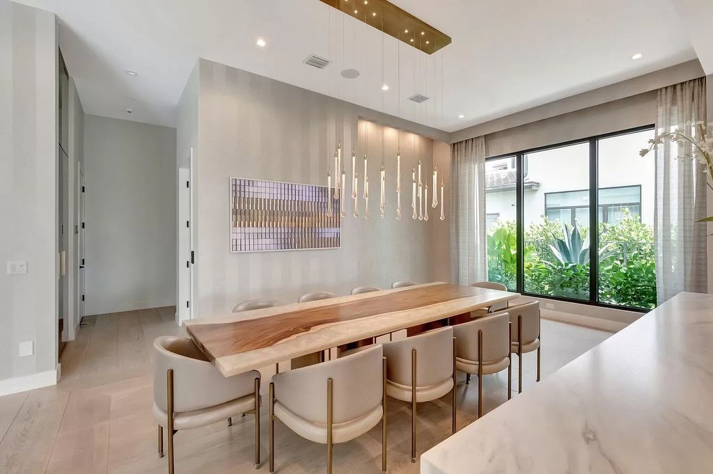 Welcome to this lavish modern luxury estate in the prestigious Boca Bridges. This distinguished "Dali" contemporary masterpiece, one of only seven, spans 8,000 square feet on a large waterfront lot.