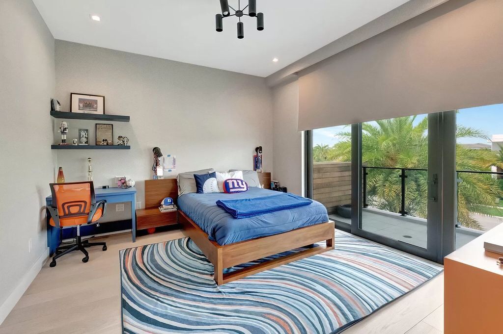 Welcome to this lavish modern luxury estate in the prestigious Boca Bridges. This distinguished "Dali" contemporary masterpiece, one of only seven, spans 8,000 square feet on a large waterfront lot.