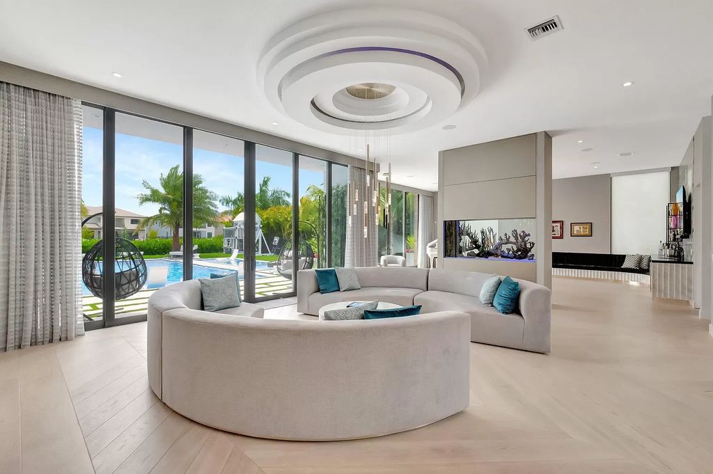 Welcome to this lavish modern luxury estate in the prestigious Boca Bridges. This distinguished "Dali" contemporary masterpiece, one of only seven, spans 8,000 square feet on a large waterfront lot.