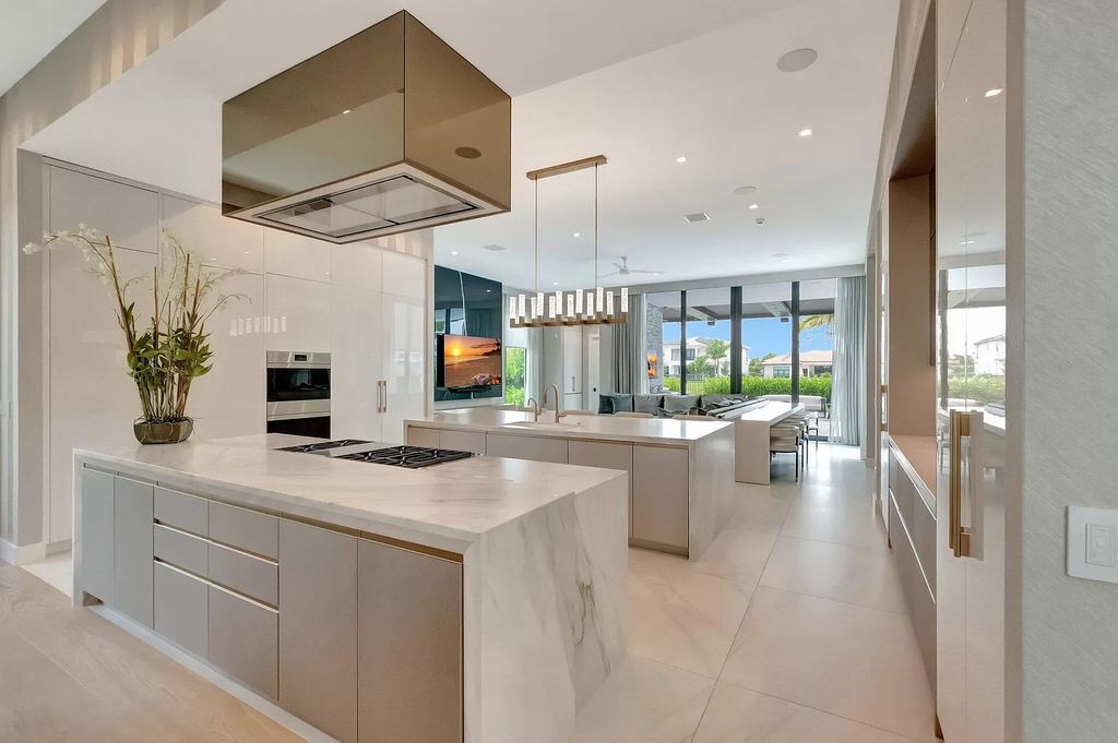 Welcome to this lavish modern luxury estate in the prestigious Boca Bridges. This distinguished "Dali" contemporary masterpiece, one of only seven, spans 8,000 square feet on a large waterfront lot.