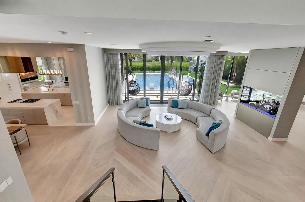 Welcome to this lavish modern luxury estate in the prestigious Boca Bridges. This distinguished "Dali" contemporary masterpiece, one of only seven, spans 8,000 square feet on a large waterfront lot.