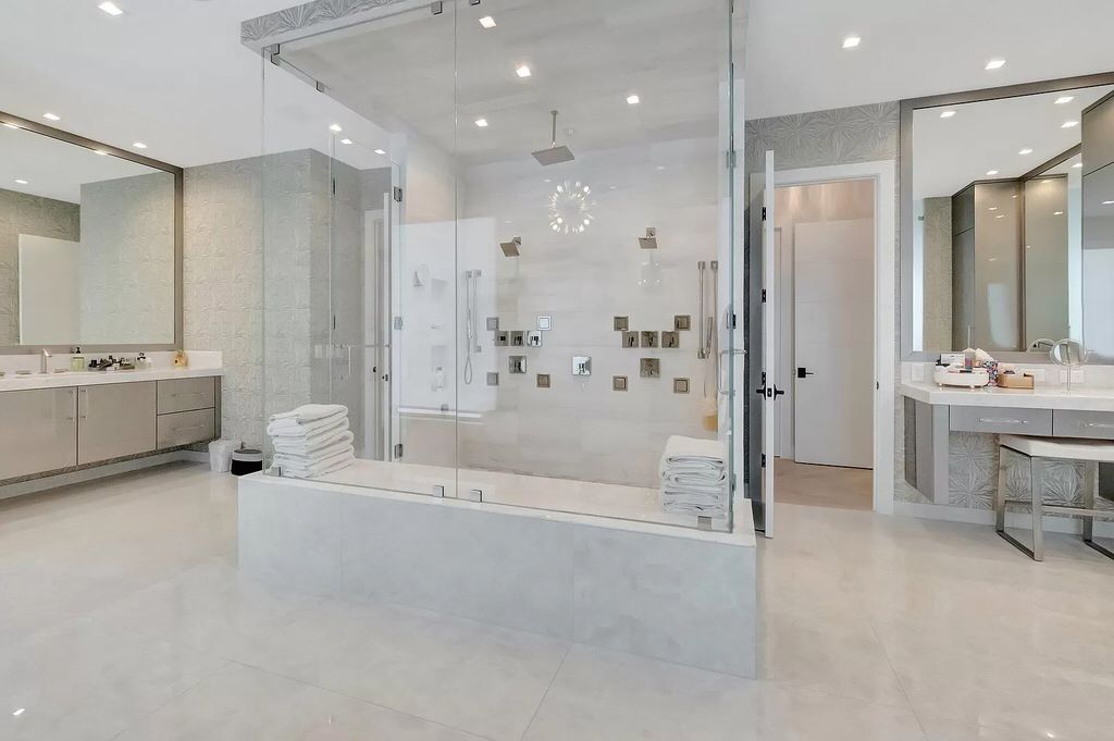 Welcome to this lavish modern luxury estate in the prestigious Boca Bridges. This distinguished "Dali" contemporary masterpiece, one of only seven, spans 8,000 square feet on a large waterfront lot.