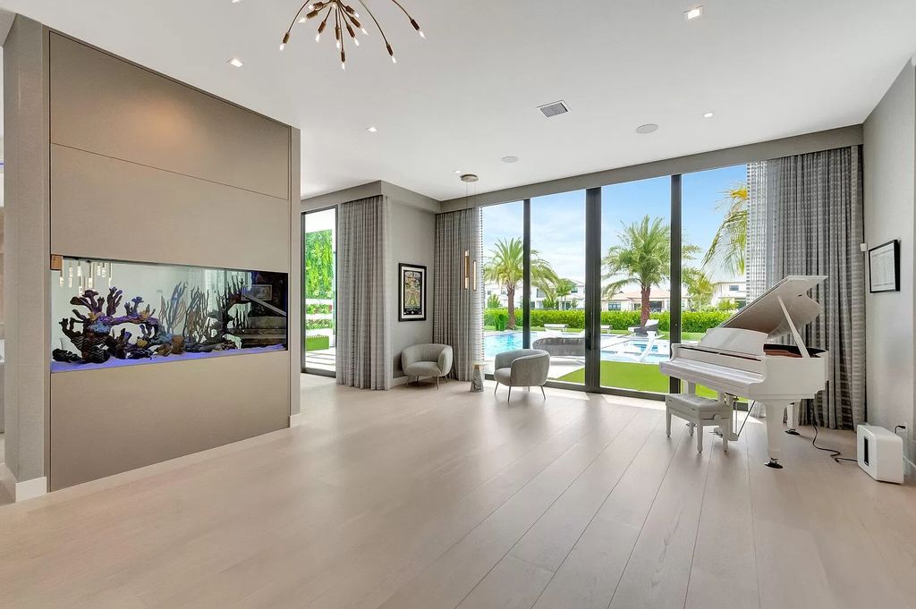 Welcome to this lavish modern luxury estate in the prestigious Boca Bridges. This distinguished "Dali" contemporary masterpiece, one of only seven, spans 8,000 square feet on a large waterfront lot.