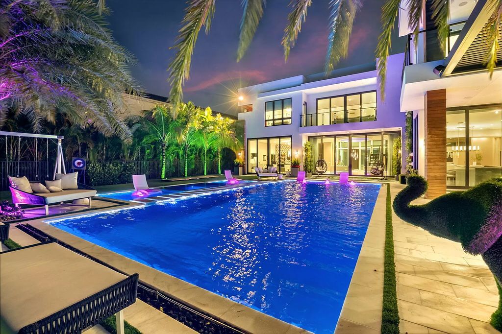 Welcome to this lavish modern luxury estate in the prestigious Boca Bridges. This distinguished "Dali" contemporary masterpiece, one of only seven, spans 8,000 square feet on a large waterfront lot.