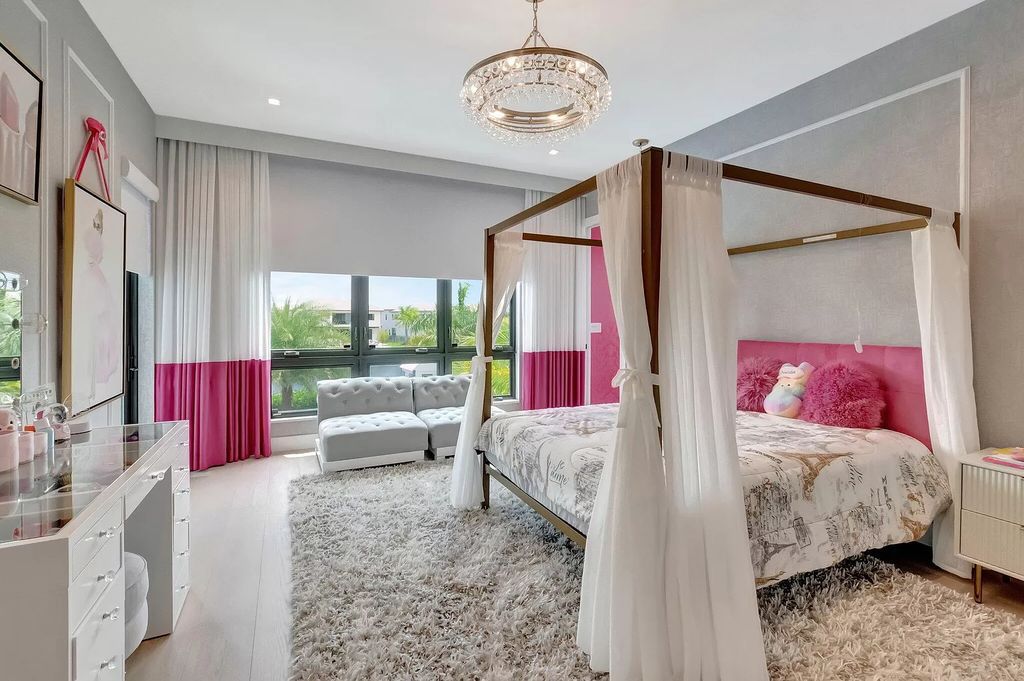 Welcome to this lavish modern luxury estate in the prestigious Boca Bridges. This distinguished "Dali" contemporary masterpiece, one of only seven, spans 8,000 square feet on a large waterfront lot.