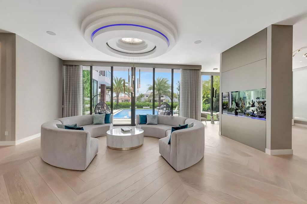 Welcome to this lavish modern luxury estate in the prestigious Boca Bridges. This distinguished "Dali" contemporary masterpiece, one of only seven, spans 8,000 square feet on a large waterfront lot.