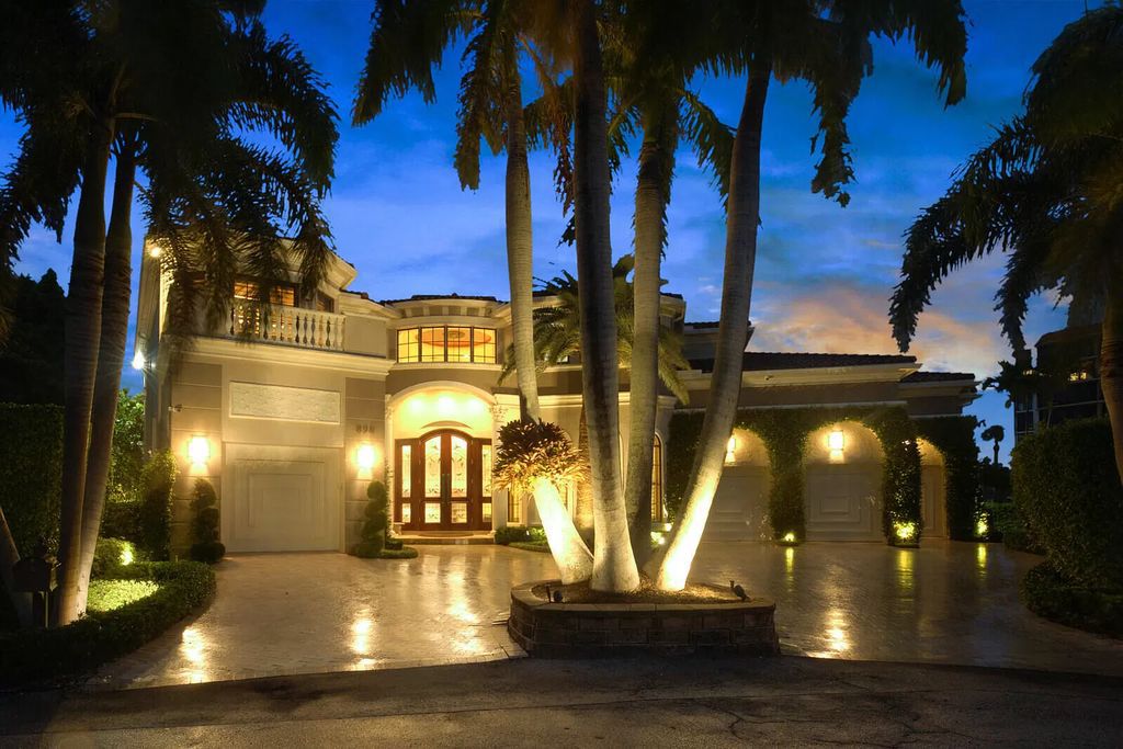 This dream home features a home office, theater, chef's kitchen with high-end appliances, dual-zone wine refrigerators, and lavish architectural details.