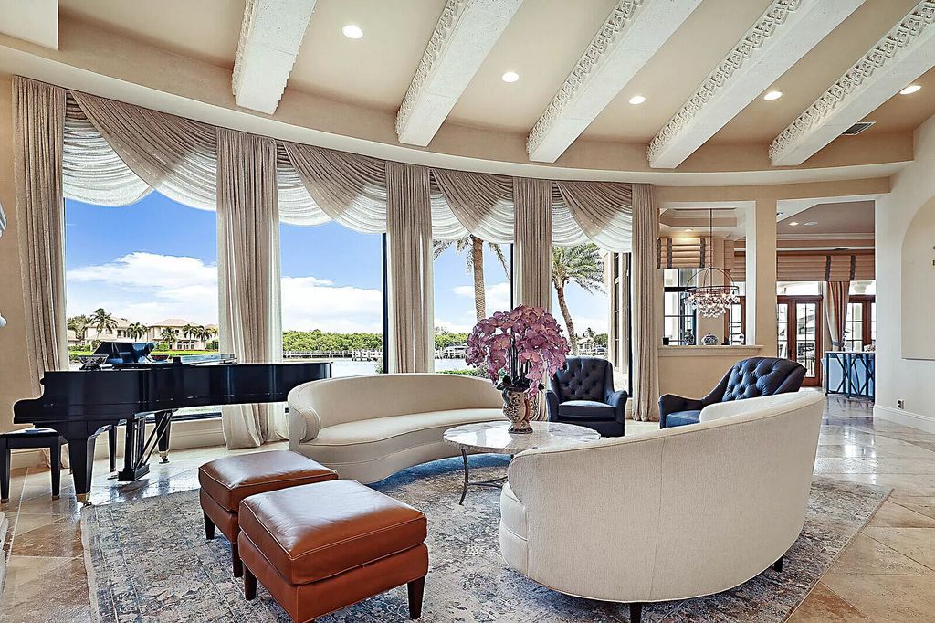 This dream home features a home office, theater, chef's kitchen with high-end appliances, dual-zone wine refrigerators, and lavish architectural details.