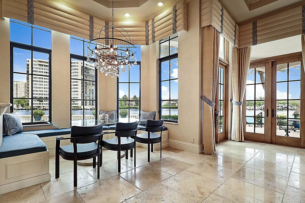 This dream home features a home office, theater, chef's kitchen with high-end appliances, dual-zone wine refrigerators, and lavish architectural details.