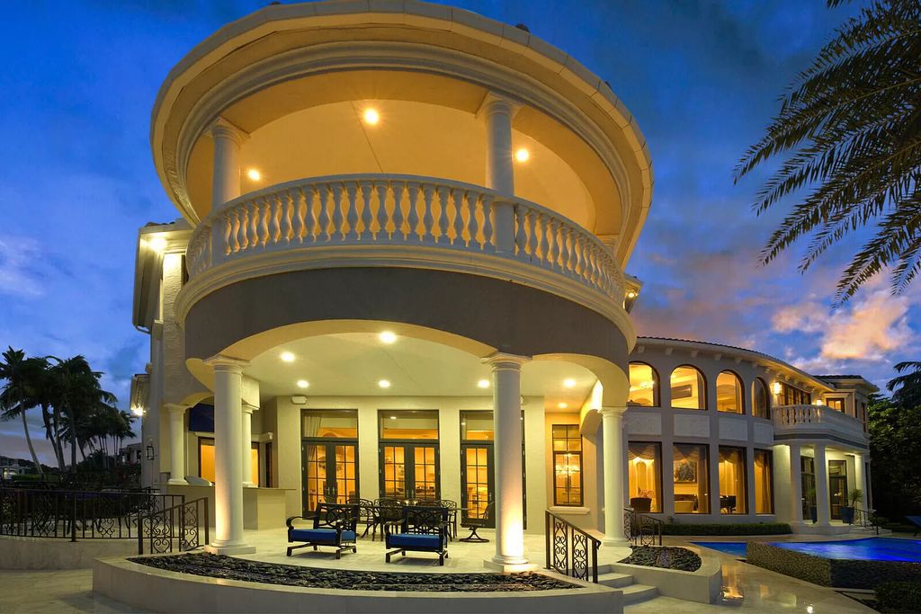 This dream home features a home office, theater, chef's kitchen with high-end appliances, dual-zone wine refrigerators, and lavish architectural details.