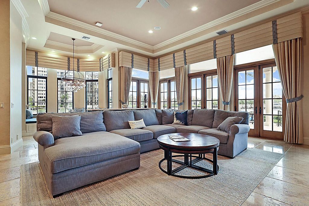 This dream home features a home office, theater, chef's kitchen with high-end appliances, dual-zone wine refrigerators, and lavish architectural details.