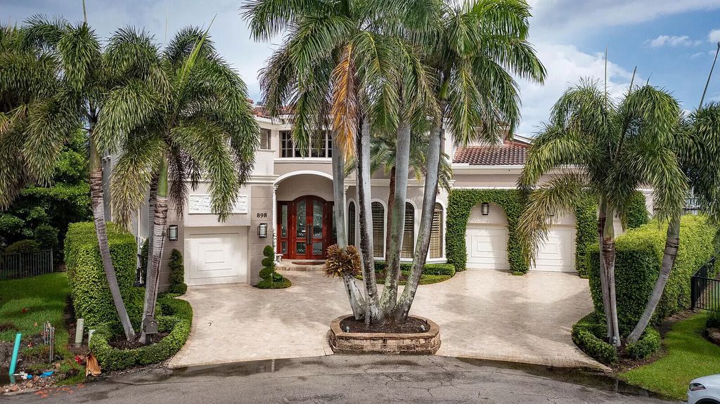 This dream home features a home office, theater, chef's kitchen with high-end appliances, dual-zone wine refrigerators, and lavish architectural details.