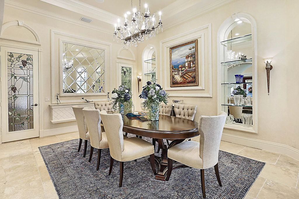 This dream home features a home office, theater, chef's kitchen with high-end appliances, dual-zone wine refrigerators, and lavish architectural details.
