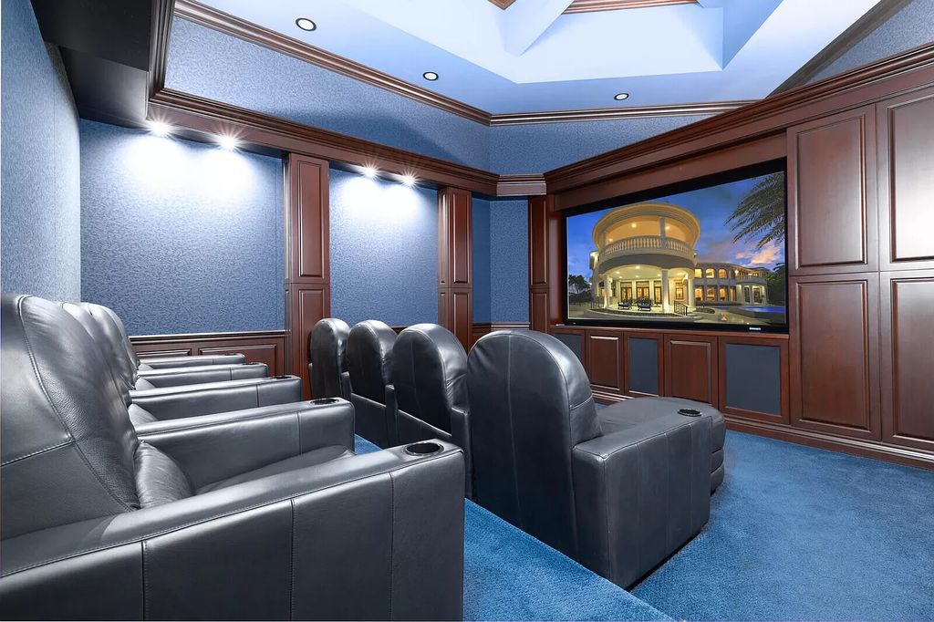 This dream home features a home office, theater, chef's kitchen with high-end appliances, dual-zone wine refrigerators, and lavish architectural details.