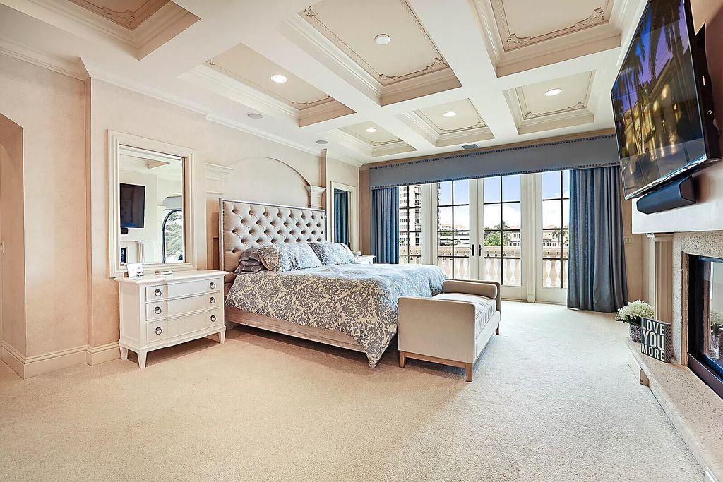 This dream home features a home office, theater, chef's kitchen with high-end appliances, dual-zone wine refrigerators, and lavish architectural details.