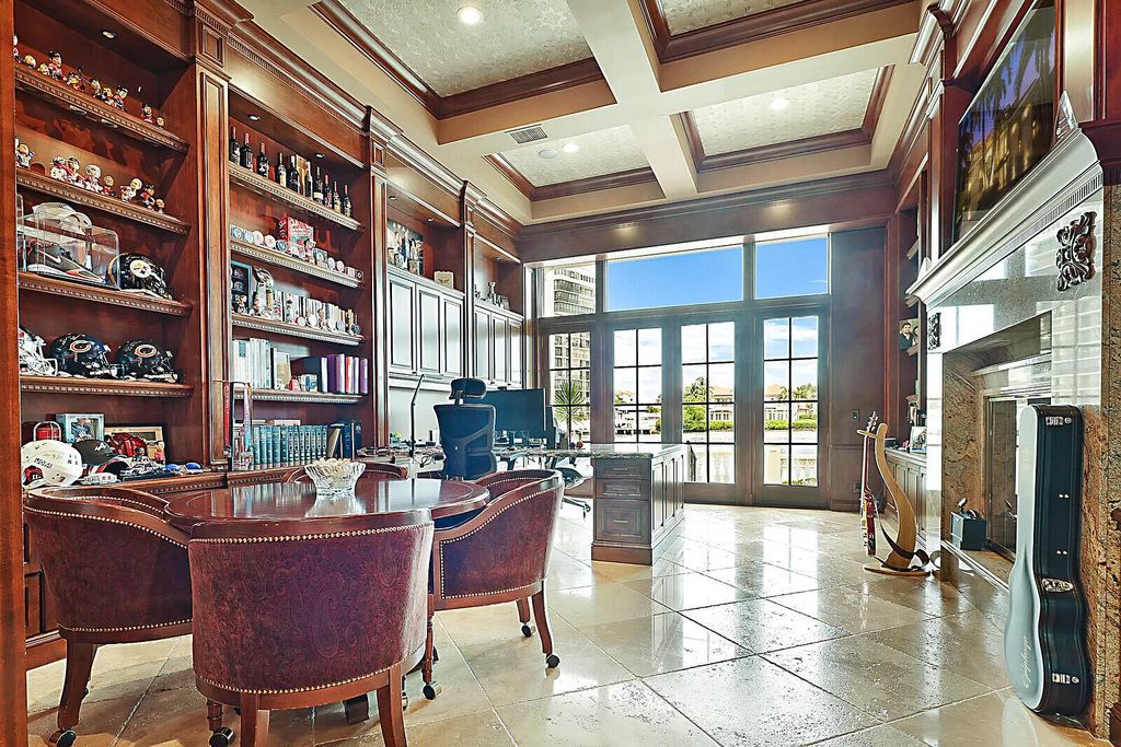 This dream home features a home office, theater, chef's kitchen with high-end appliances, dual-zone wine refrigerators, and lavish architectural details.