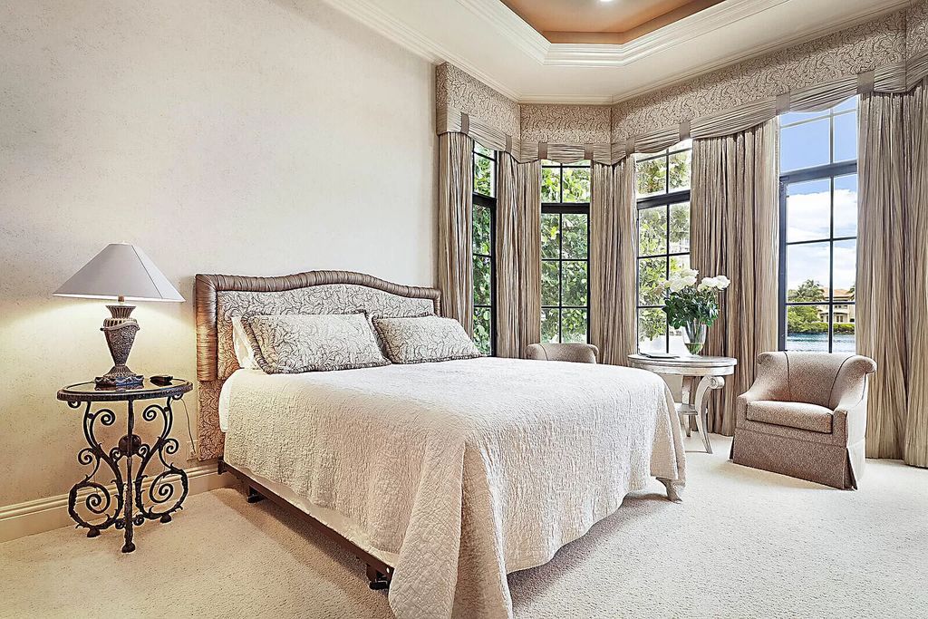This dream home features a home office, theater, chef's kitchen with high-end appliances, dual-zone wine refrigerators, and lavish architectural details.