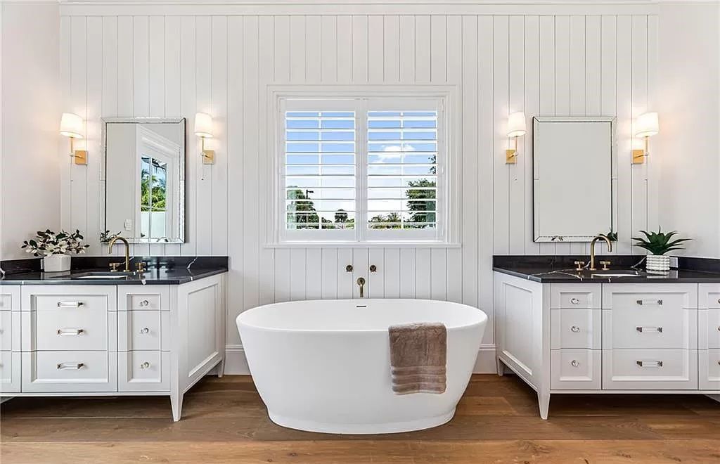 Experience luxury in this modern farmhouse at 712 Killdeer Pl, Naples, Florida. Built by the award-winning Van Emmerik Custom Homes, this 6,500 square feet home features high ceilings, beautiful millwork, and premium finishes.