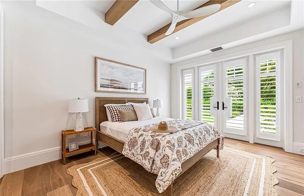 Experience luxury in this modern farmhouse at 712 Killdeer Pl, Naples, Florida. Built by the award-winning Van Emmerik Custom Homes, this 6,500 square feet home features high ceilings, beautiful millwork, and premium finishes.