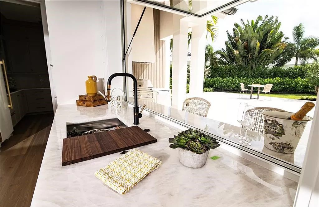 Experience luxury in this modern farmhouse at 712 Killdeer Pl, Naples, Florida. Built by the award-winning Van Emmerik Custom Homes, this 6,500 square feet home features high ceilings, beautiful millwork, and premium finishes.