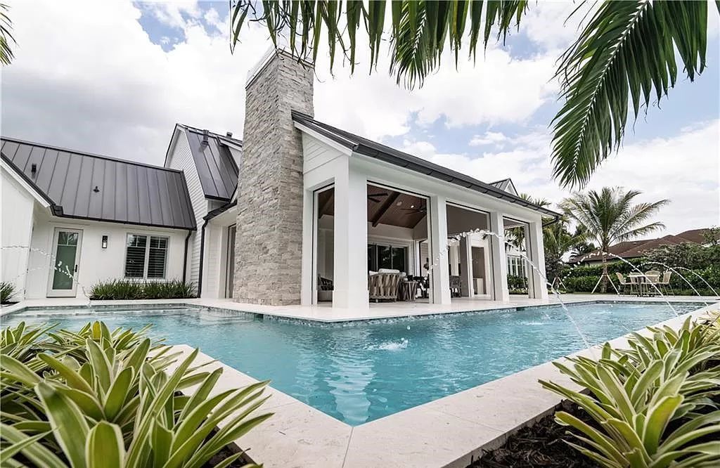 Experience luxury in this modern farmhouse at 712 Killdeer Pl, Naples, Florida. Built by the award-winning Van Emmerik Custom Homes, this 6,500 square feet home features high ceilings, beautiful millwork, and premium finishes.