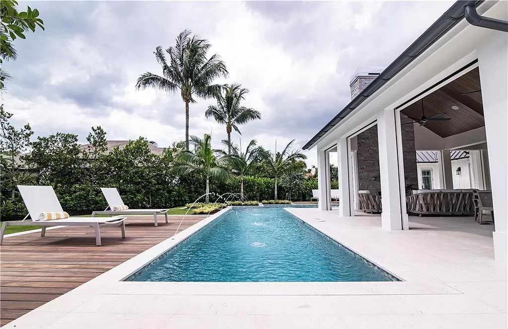 Experience luxury in this modern farmhouse at 712 Killdeer Pl, Naples, Florida. Built by the award-winning Van Emmerik Custom Homes, this 6,500 square feet home features high ceilings, beautiful millwork, and premium finishes.