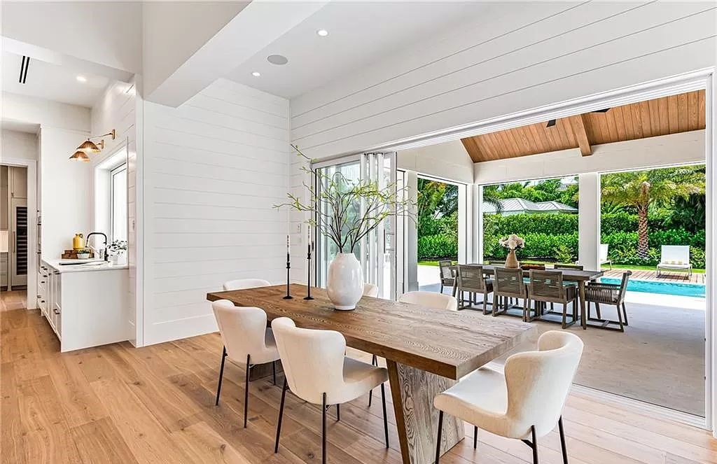 Experience luxury in this modern farmhouse at 712 Killdeer Pl, Naples, Florida. Built by the award-winning Van Emmerik Custom Homes, this 6,500 square feet home features high ceilings, beautiful millwork, and premium finishes.
