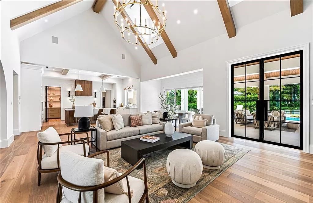 Experience luxury in this modern farmhouse at 712 Killdeer Pl, Naples, Florida. Built by the award-winning Van Emmerik Custom Homes, this 6,500 square feet home features high ceilings, beautiful millwork, and premium finishes.