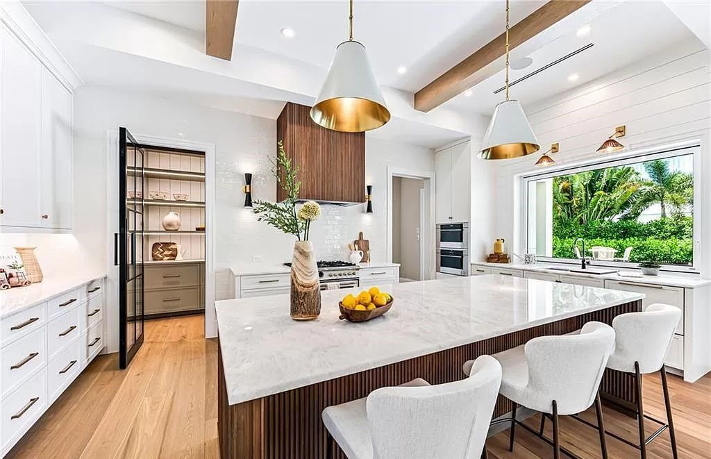 Experience luxury in this modern farmhouse at 712 Killdeer Pl, Naples, Florida. Built by the award-winning Van Emmerik Custom Homes, this 6,500 square feet home features high ceilings, beautiful millwork, and premium finishes.