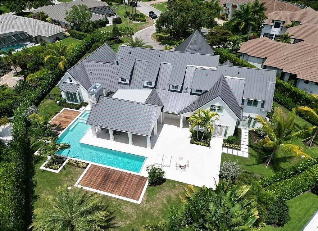 Experience luxury in this modern farmhouse at 712 Killdeer Pl, Naples, Florida. Built by the award-winning Van Emmerik Custom Homes, this 6,500 square feet home features high ceilings, beautiful millwork, and premium finishes.