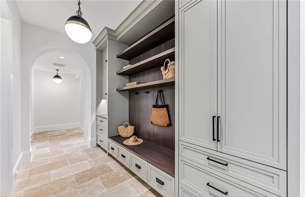 Experience luxury in this modern farmhouse at 712 Killdeer Pl, Naples, Florida. Built by the award-winning Van Emmerik Custom Homes, this 6,500 square feet home features high ceilings, beautiful millwork, and premium finishes.