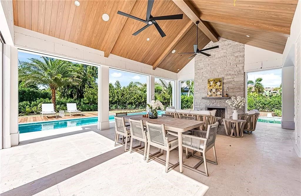 Experience luxury in this modern farmhouse at 712 Killdeer Pl, Naples, Florida. Built by the award-winning Van Emmerik Custom Homes, this 6,500 square feet home features high ceilings, beautiful millwork, and premium finishes.