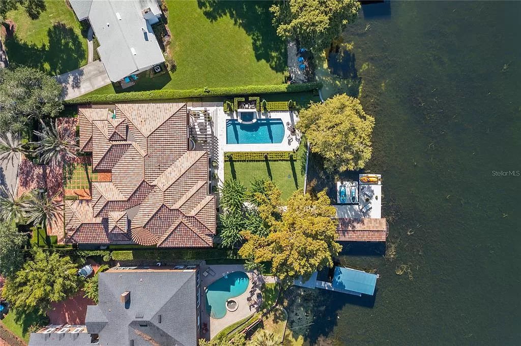Introducing a rare opportunity to own a unique lakeside property on Lake Maitland, part of the prestigious Chain of Lakes.