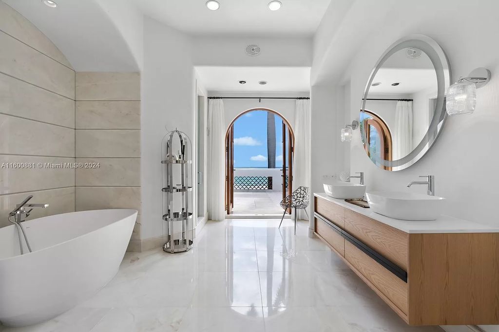 This 11,599 square feet estate on a 41,750 square feet lot includes 150 feet of private ocean frontage.