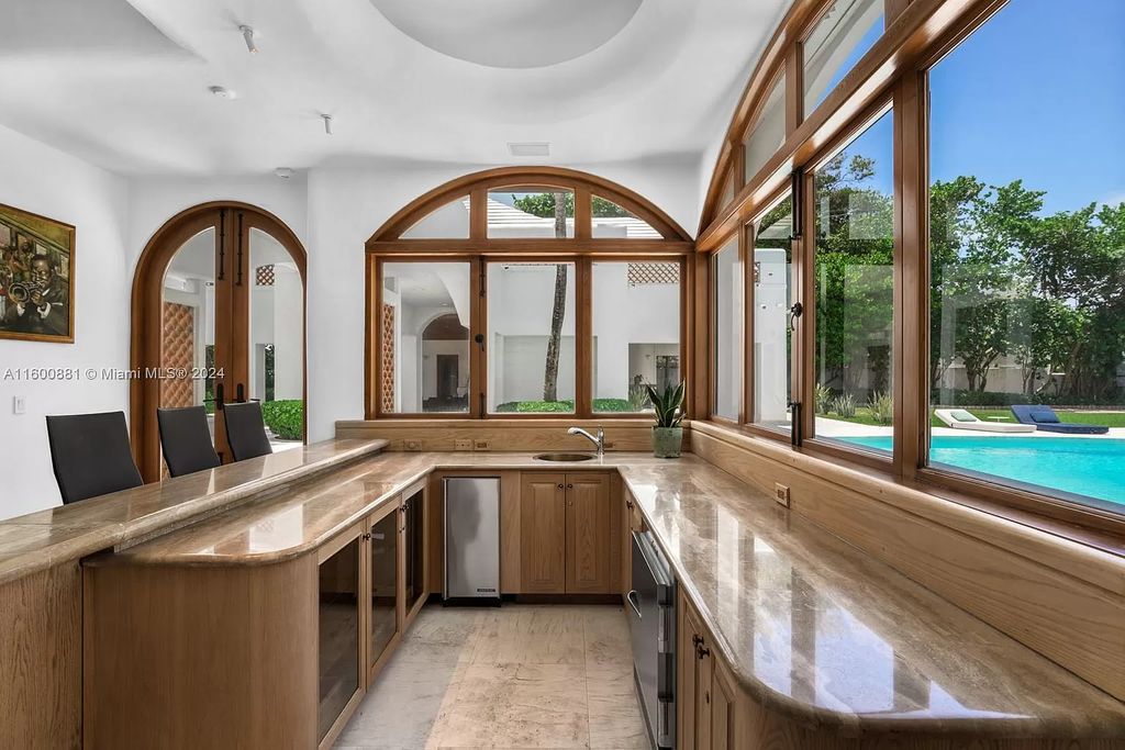 This 11,599 square feet estate on a 41,750 square feet lot includes 150 feet of private ocean frontage.