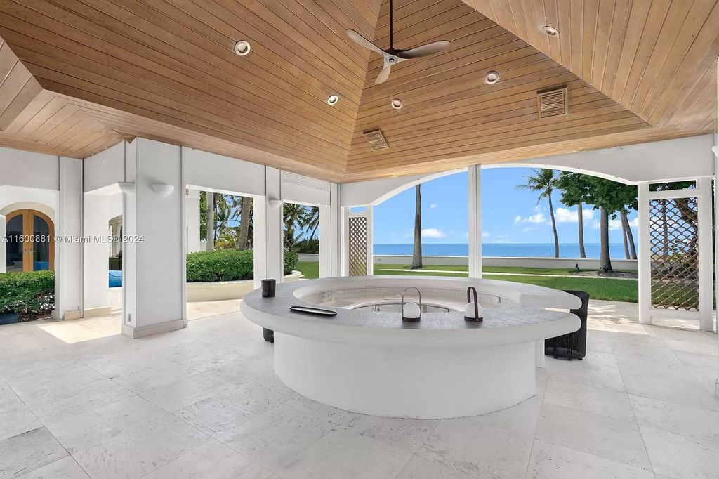 This 11,599 square feet estate on a 41,750 square feet lot includes 150 feet of private ocean frontage.