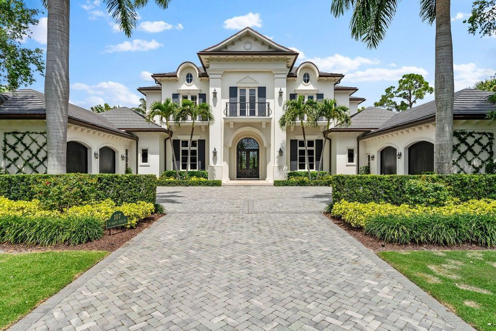 Welcome to 107 W Bears Club Dr, an exquisite custom-built estate in the exclusive Bears Club community in Jupiter, Florida.