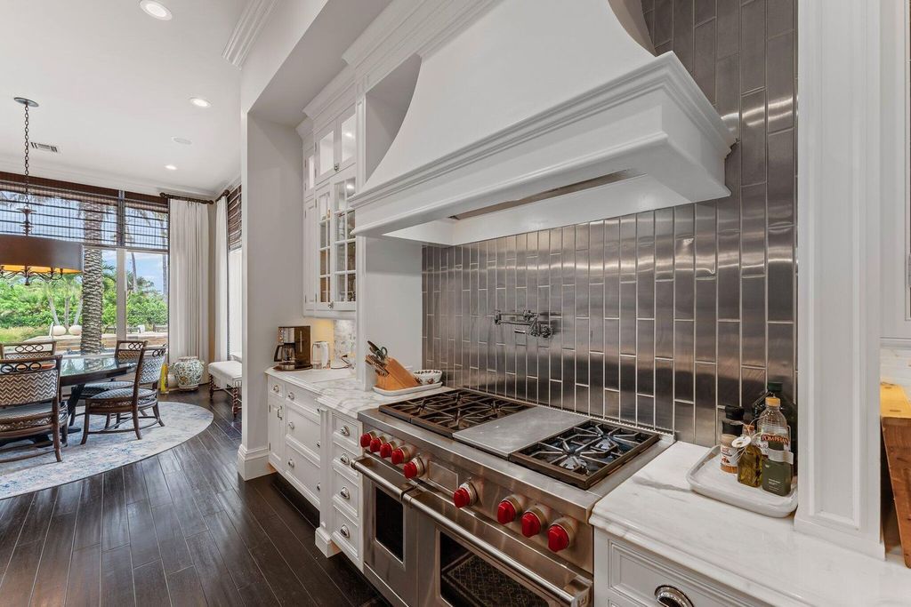 Welcome to 107 W Bears Club Dr, an exquisite custom-built estate in the exclusive Bears Club community in Jupiter, Florida.