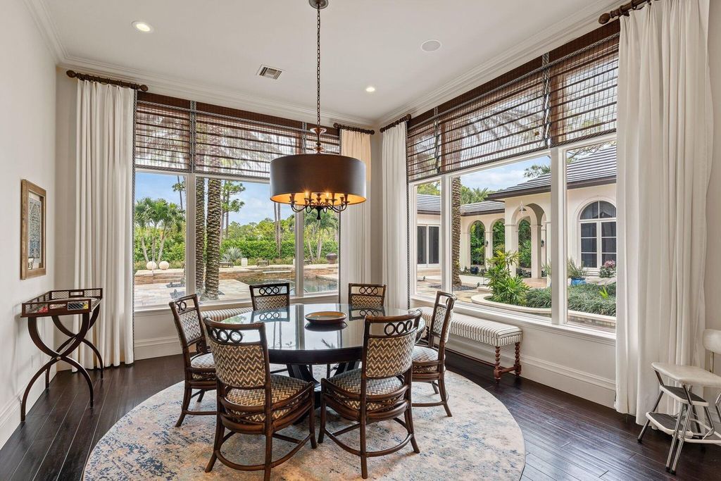 Welcome to 107 W Bears Club Dr, an exquisite custom-built estate in the exclusive Bears Club community in Jupiter, Florida.